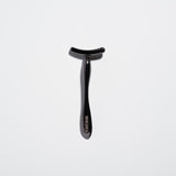 Black Tsuki spatula for applying cream and massaging the eye area
